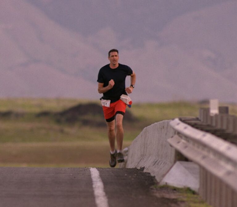 Man running along a road