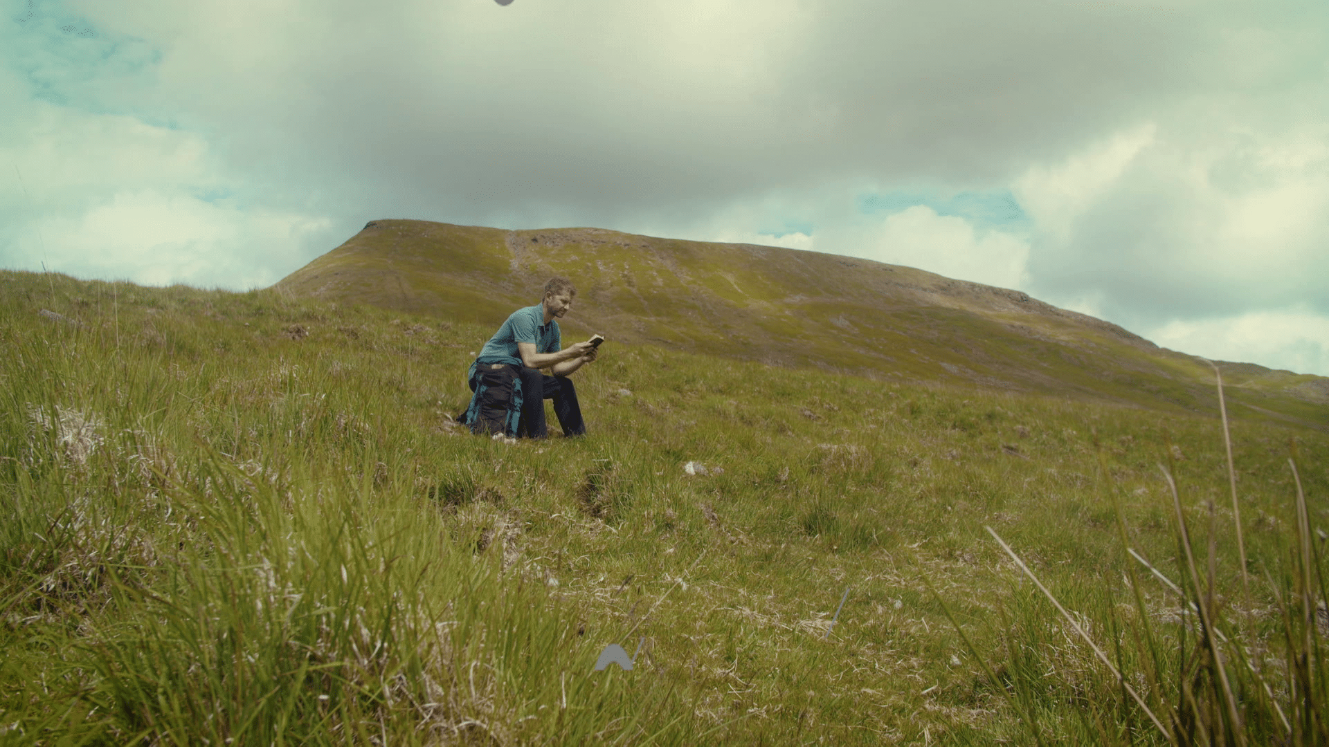 Andrew Ollerton - reading the Bible on a hill