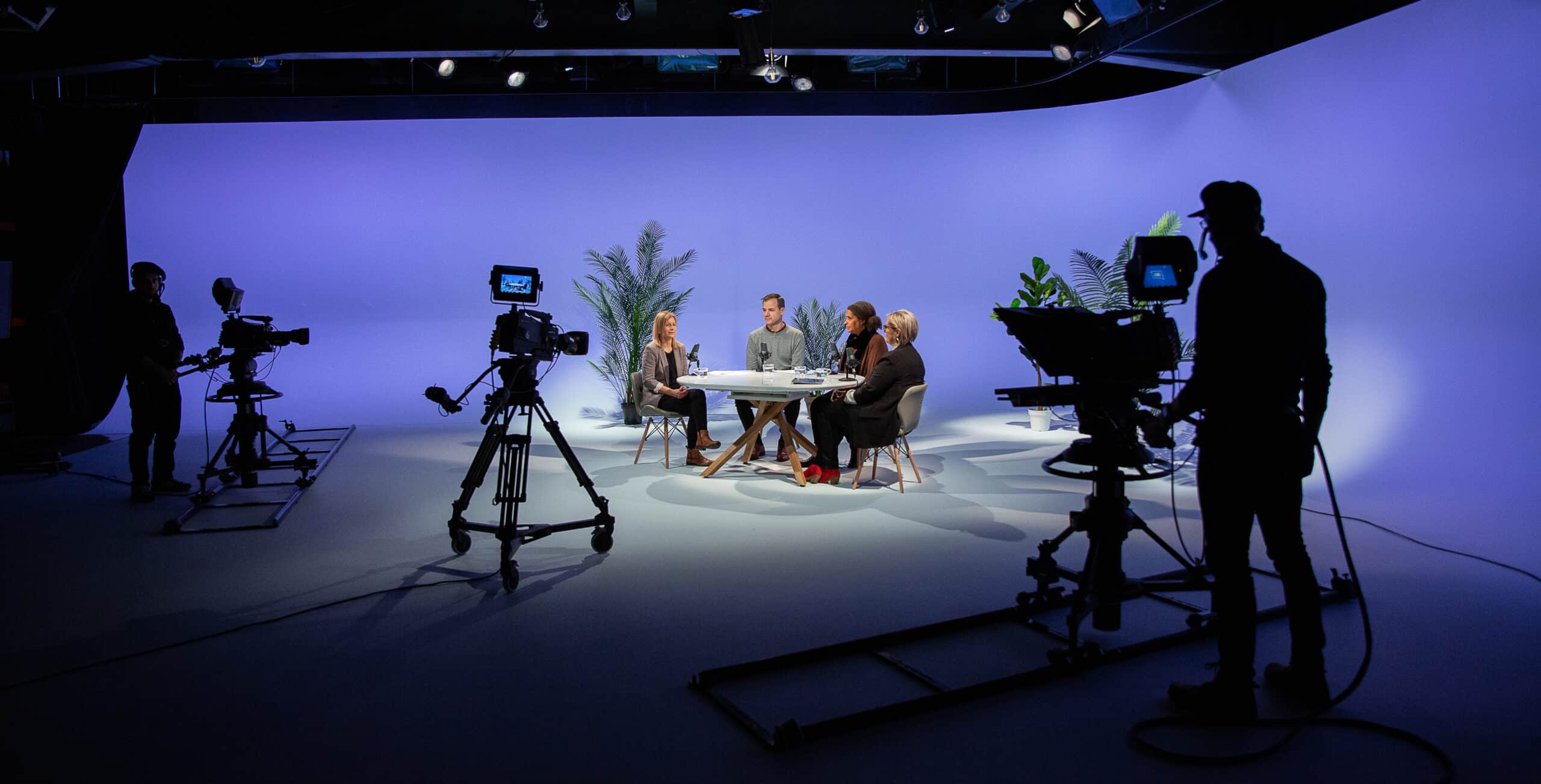 several broadcast TV cameras shooting against a cyc in the TBN UK studios