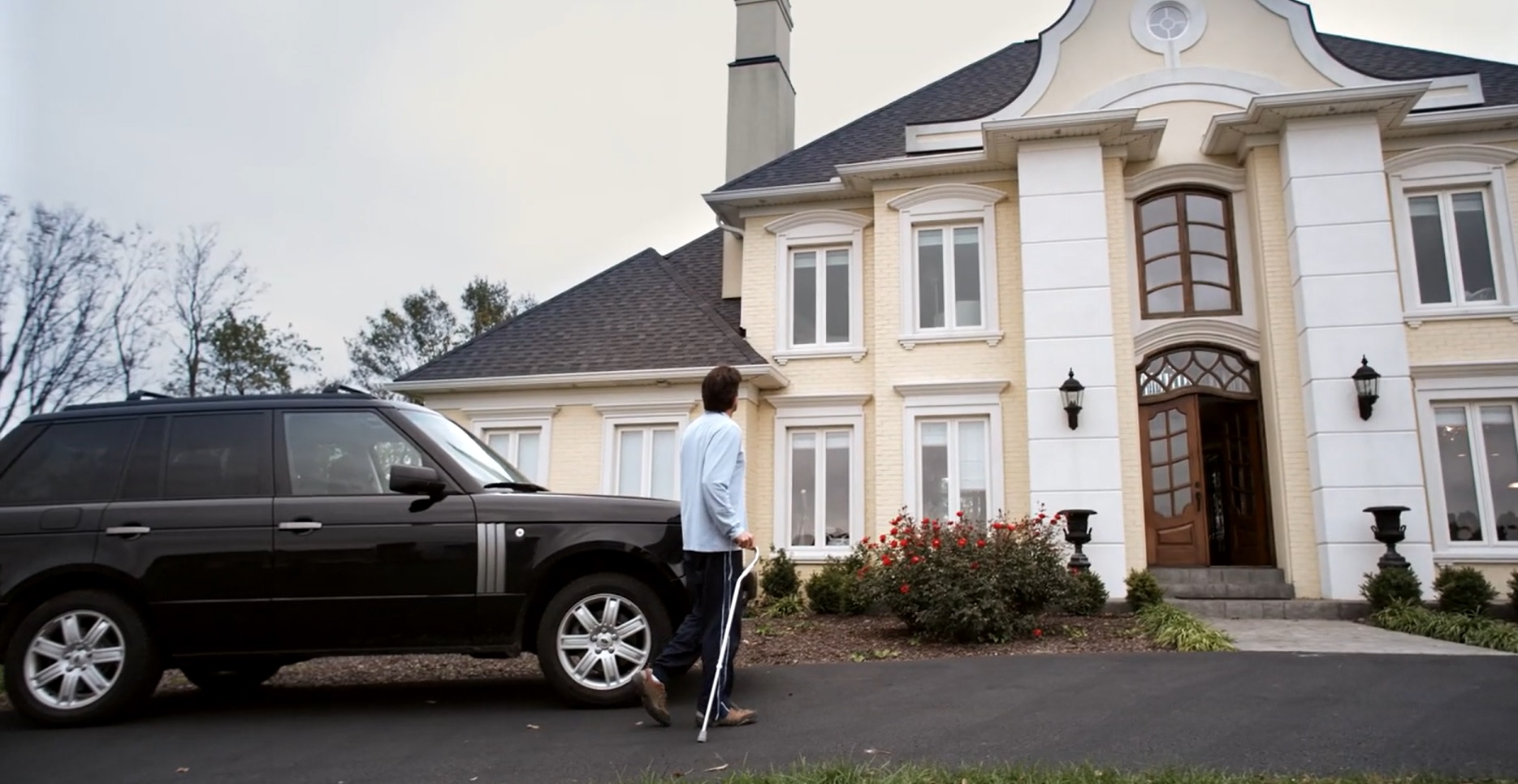 big house and big black car