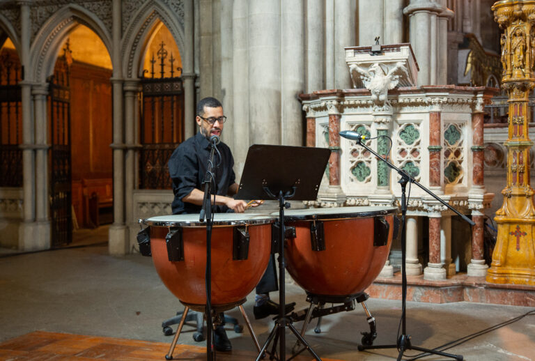 man playing the drums in church