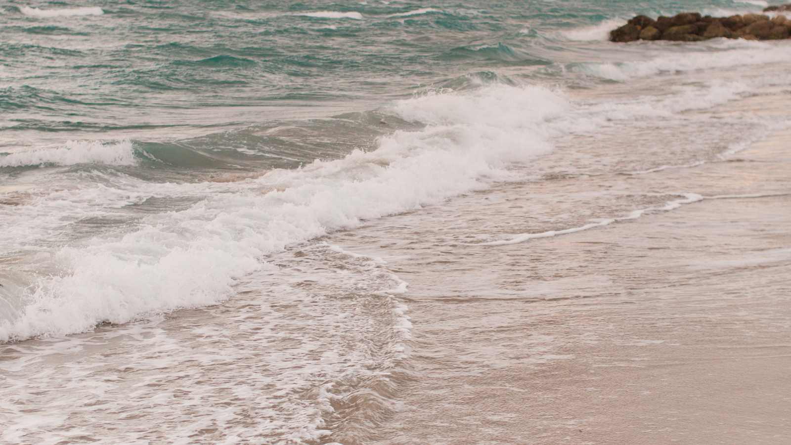 sea lapping on the shore of a beach