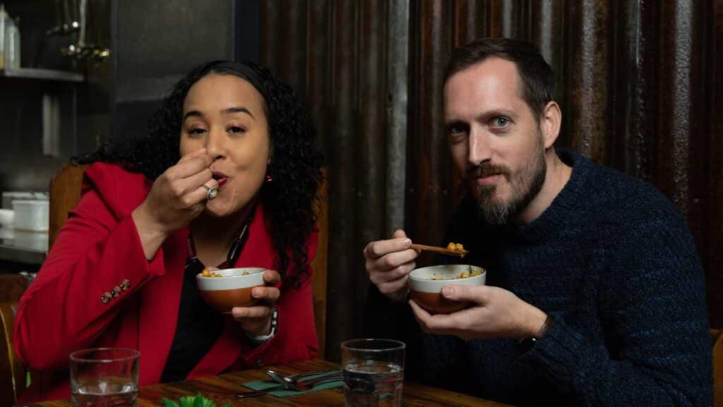 Larissa and Graham eating Caleb's delicious dahl recipe in Colombo 16