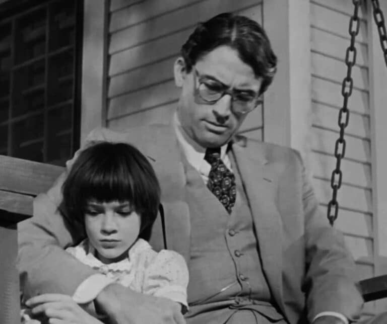 Father Teaching a child sitting on a swing chair