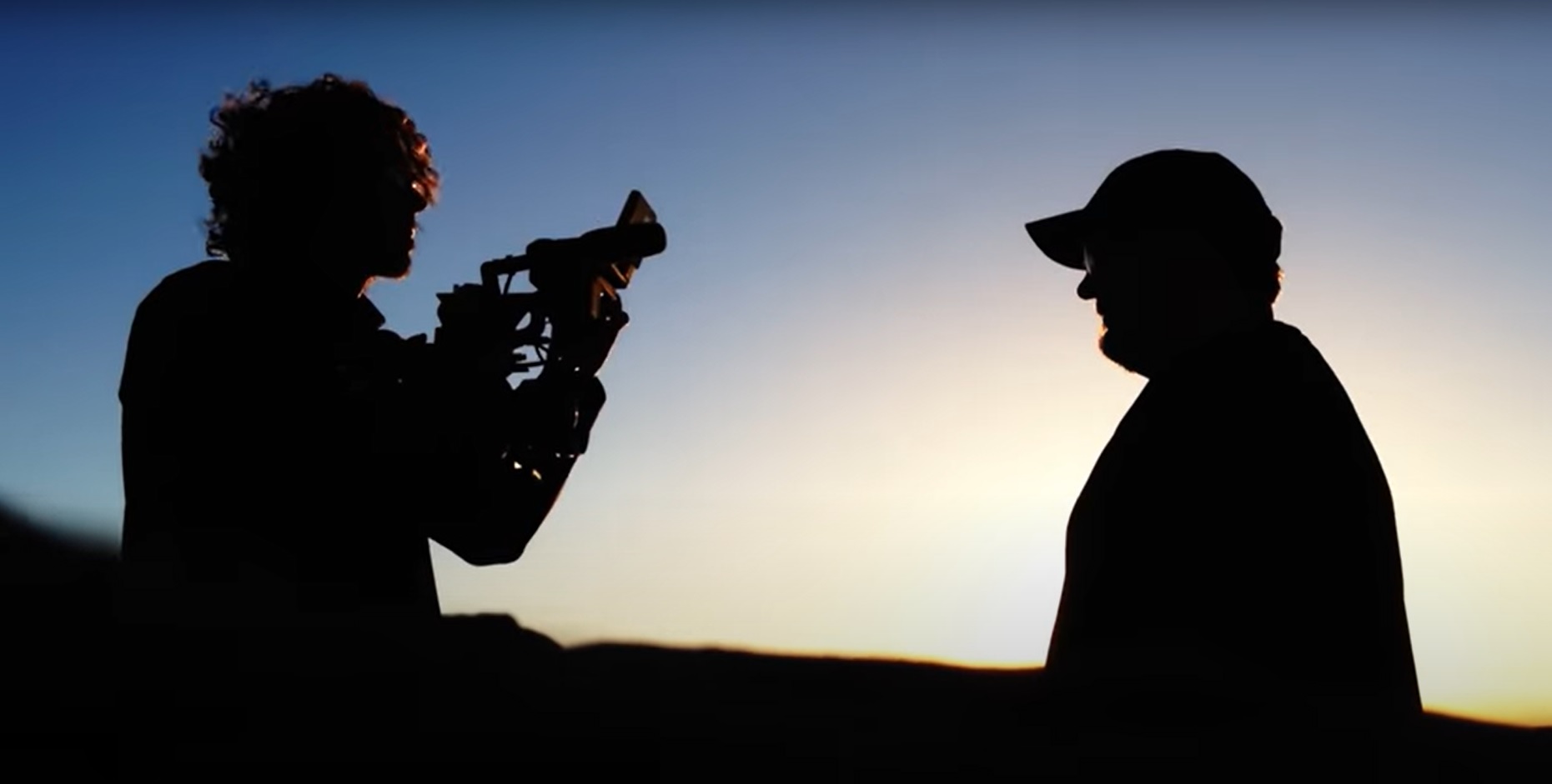 cameraman and director in silhouette