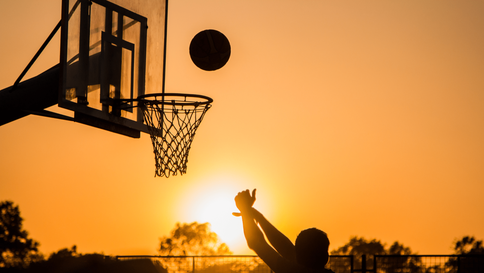 Shooting hoops - boy playing Basketball